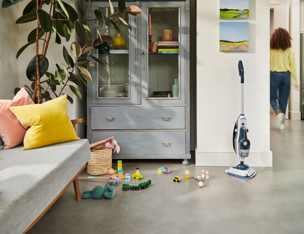 VAX Steam Fresh Home steam cleaner on display in a living space, showcasing its design and features.